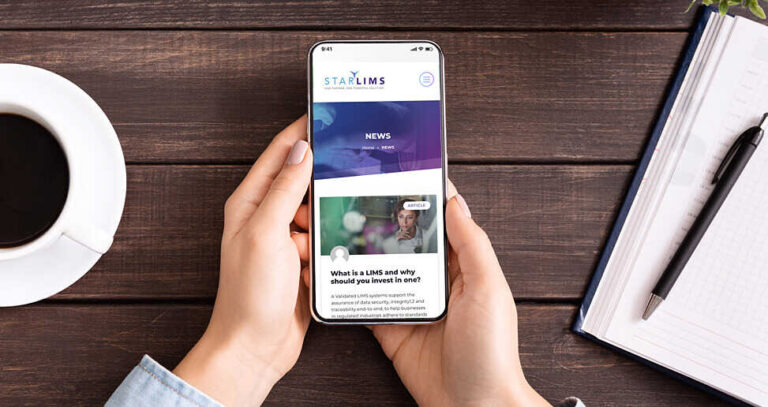 A phone displaying STARLIMS news