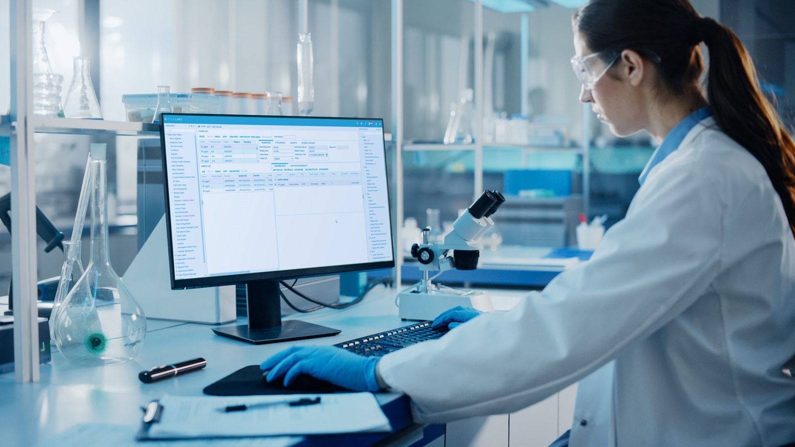 Laboratory technician working at the computer