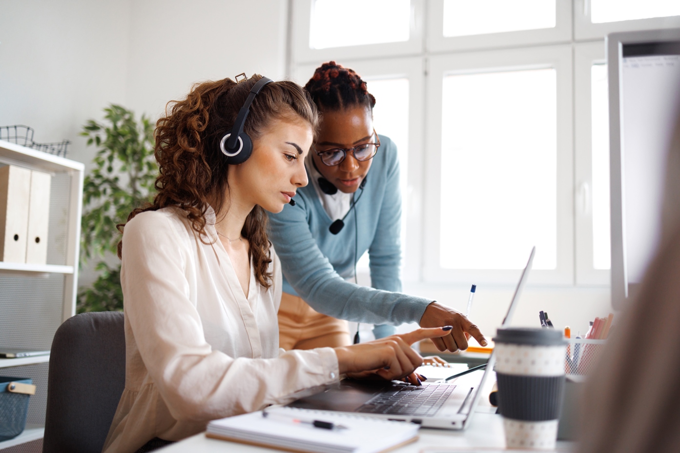 Female coworkers working together in an office.